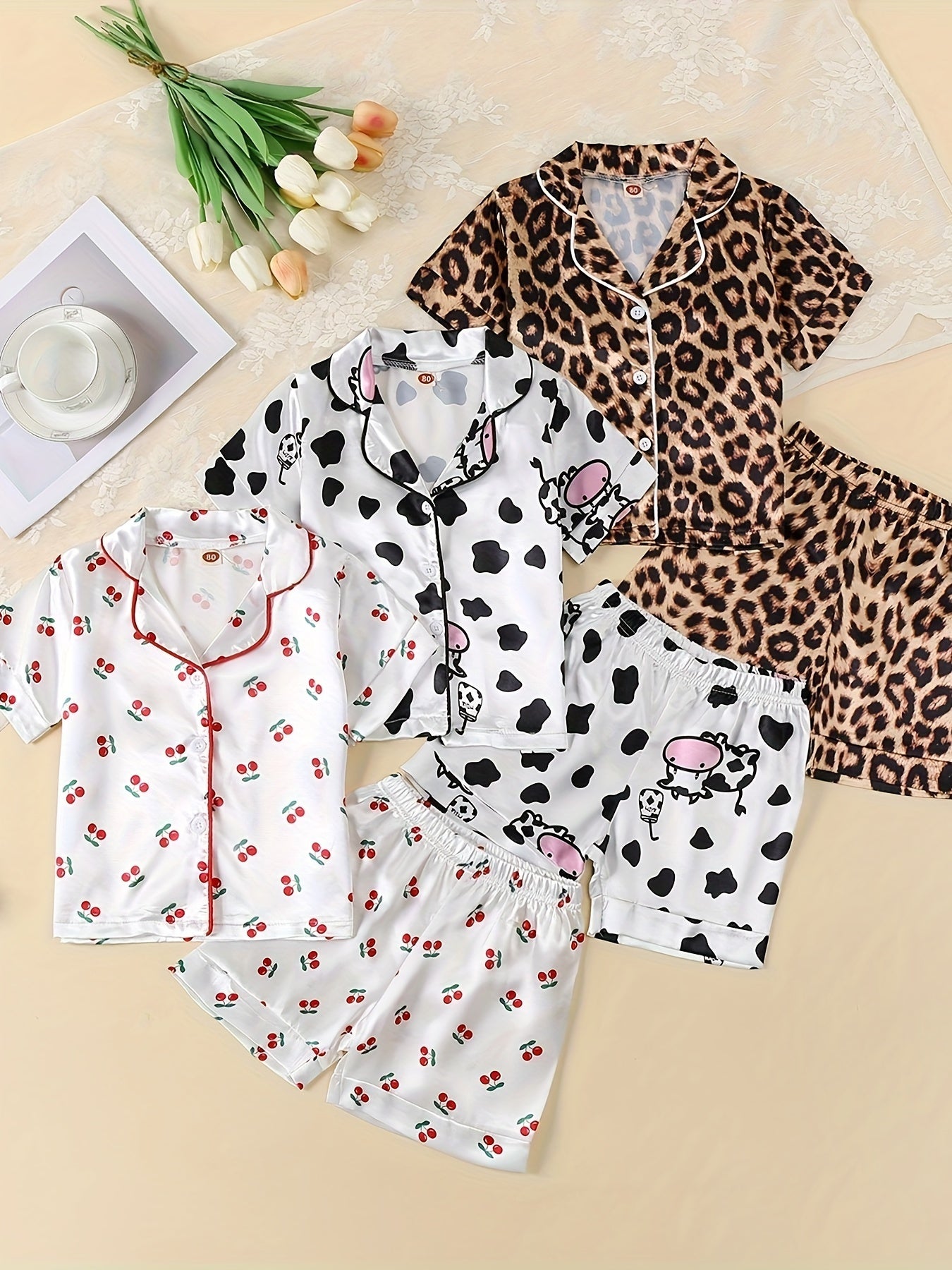 3-piece girl's ice silk clothing set features cute cow, rabbit, and leopard print. Comfortable and skin-friendly for daily wear.