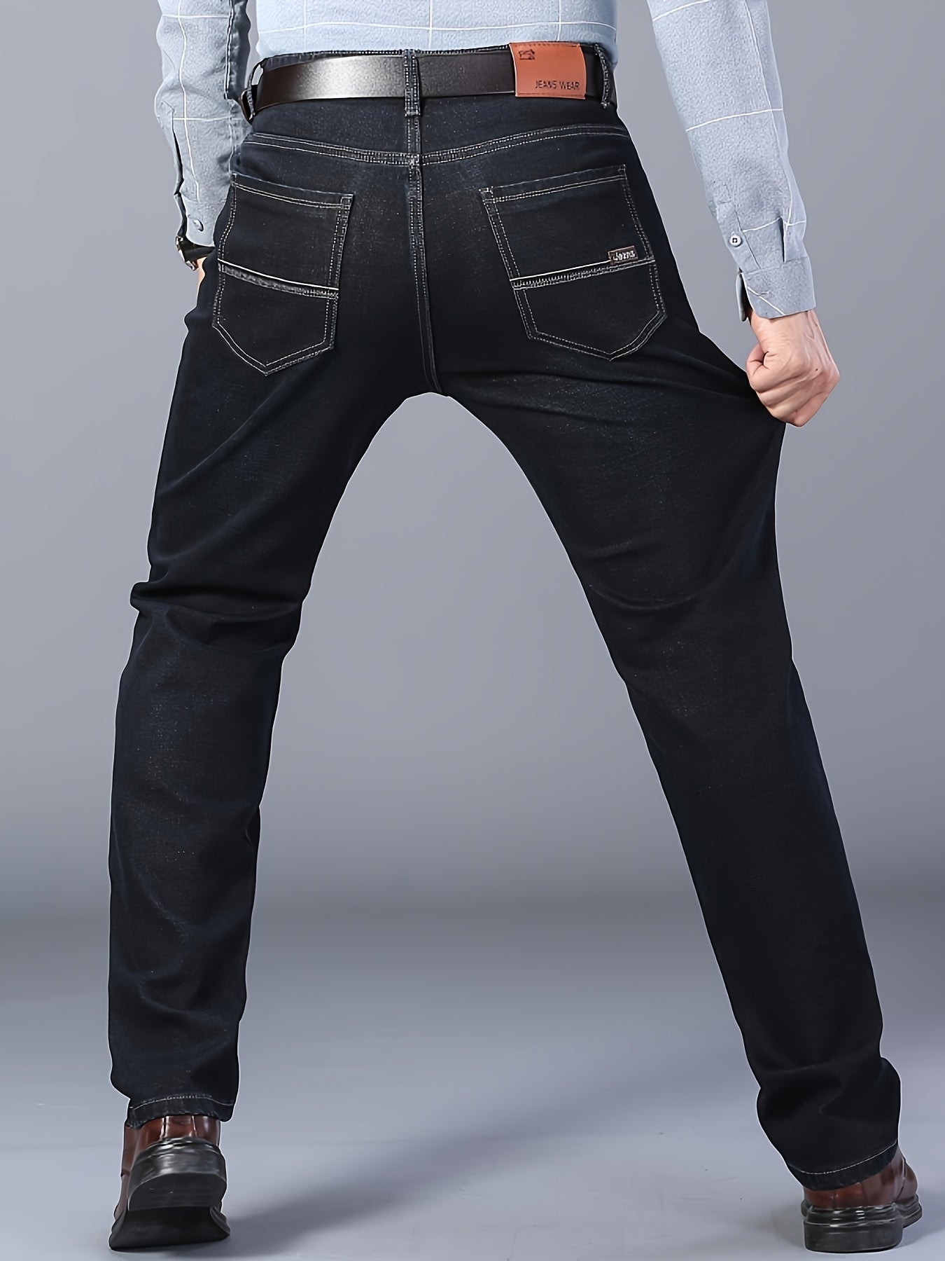 Straight leg denim jeans with classic design, slightly stretchy for versatility in business and leisure wear.