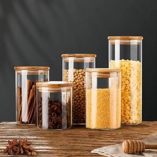 Set of 5 glass food storage jars with bamboo lids, perfect for storing dry goods such as pasta, tea, and nuts. These airtight kitchen canisters are made from high borosilicate glass with a large capacity. No electricity is needed to use these food-safe