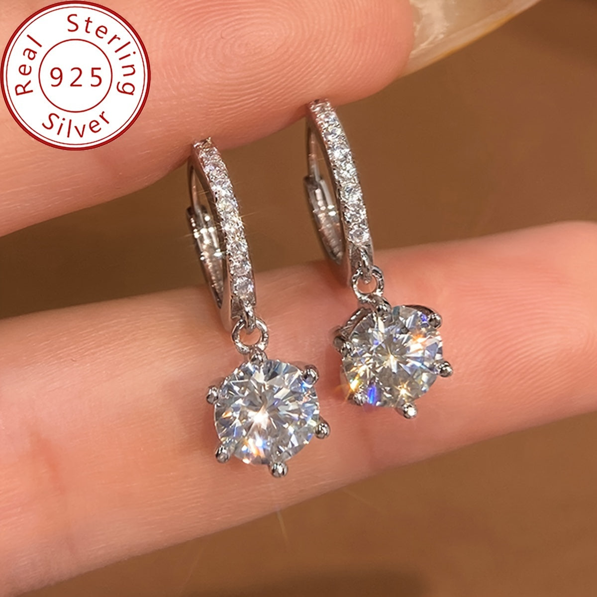 Elegant and luxurious 925 silver earrings designed with six prongs and inlaid with shiny 1ct Moissanite. Perfect for ladies, ideal for special occasions like banquets, anniversaries, or birthdays. A fashionable and delicate accessory weighing 2.6g.