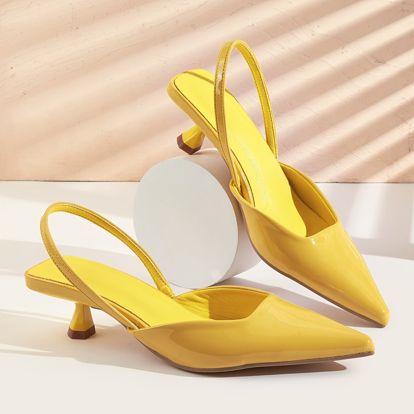 Lightweight women's kitten heel pumps with elegant design, pointed toe, ankle strap, and faux cover in various colors. Versatile for all seasons.