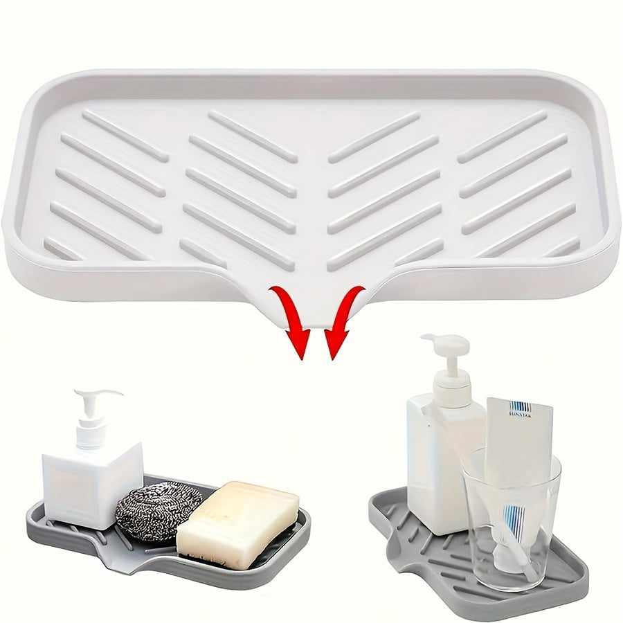 Silicone sink mat with soap dispenser, sponge drain, and countertop storage tray for drying and organizing bathroom accessories.