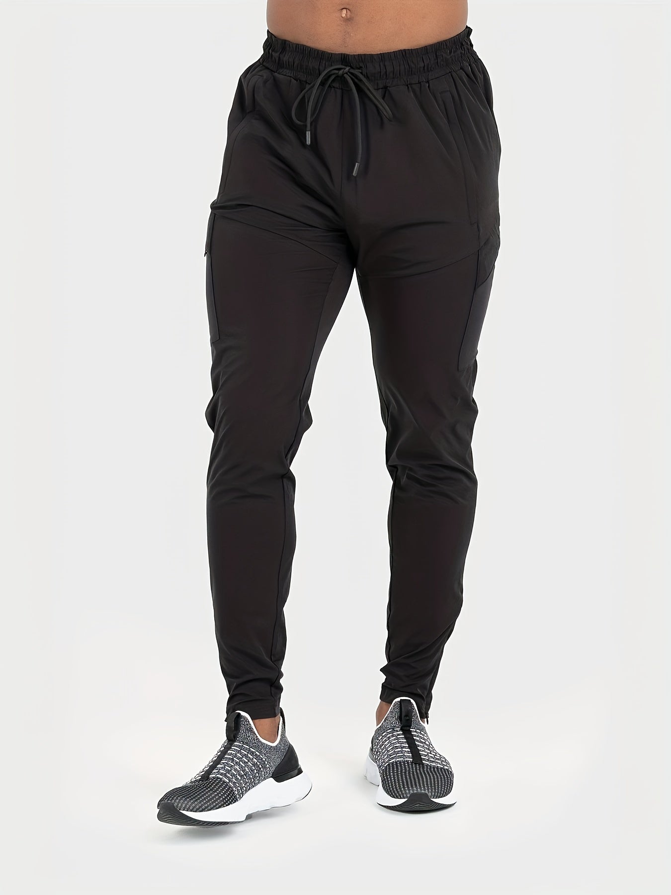 Men's athletic joggers with drawstring waist, made of 90% polyester and 10% elastane. Ideal for running, training, hiking and outdoor activities. Regular fit, tear-resistant, slight