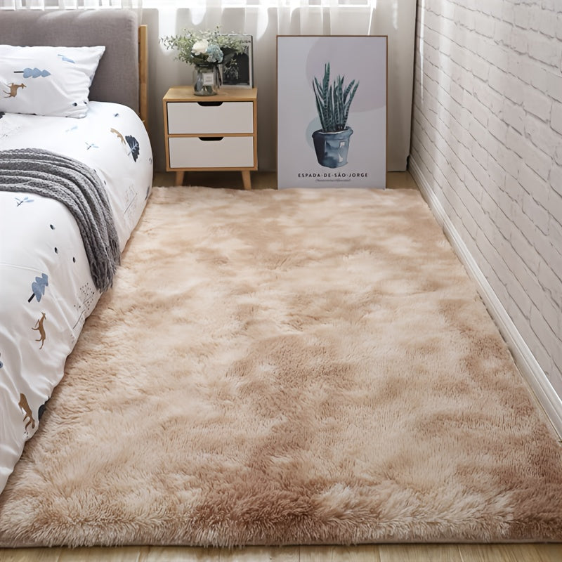 Soft fluffy area rug for bedroom, featuring a non-slip fuzzy shag plush design. This shaggy bedside rug is perfect for girls, kids, babies, teens, and dorm rooms. The tie-dyed pattern adds a fun touch to any living room or nursery. Measures 31.5*62.99