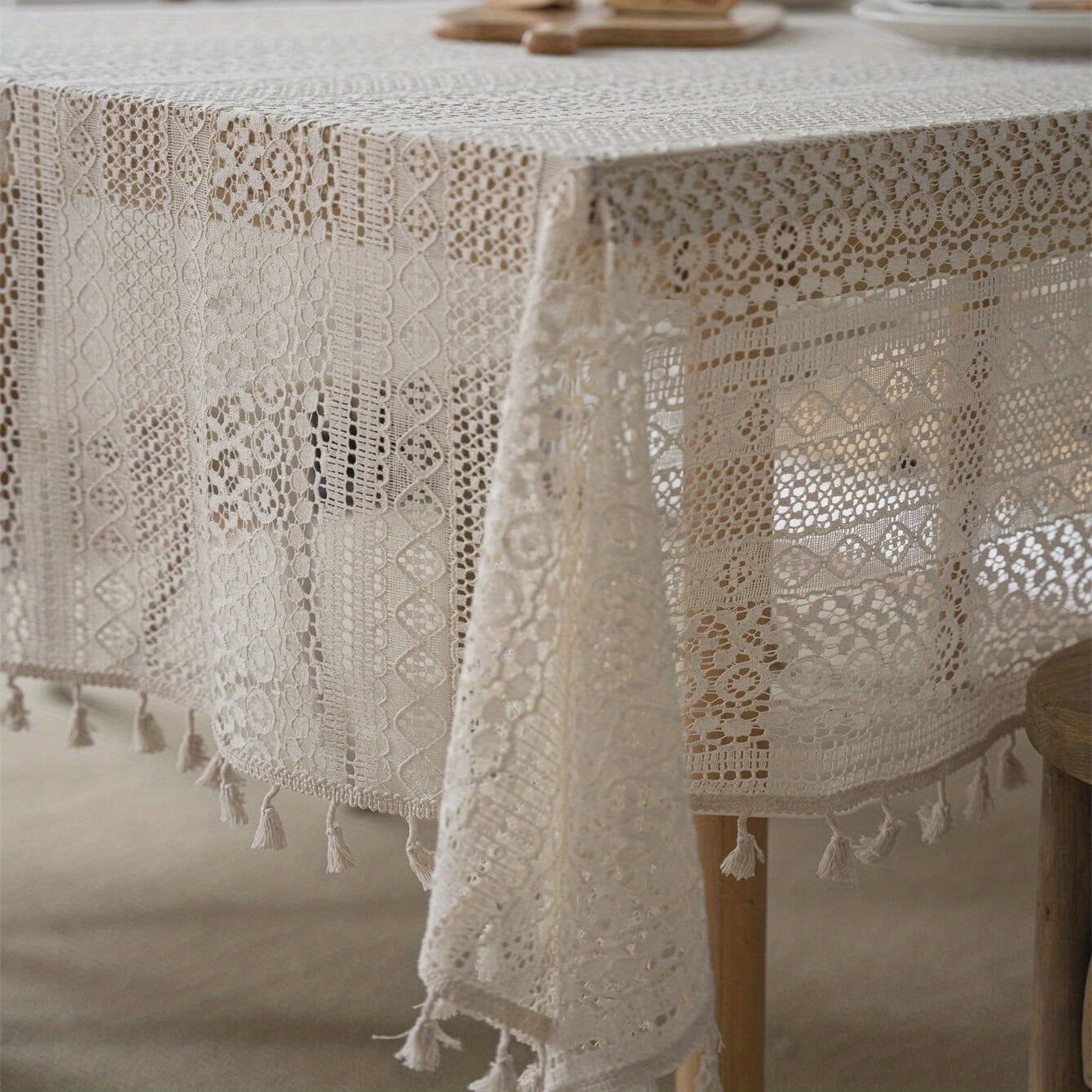 Bohemian chic crochet lace tablecloth, ideal for dining and parties. Rectangular polyester design with a farmhouse style, perfect for boho home decor. Great for buffet tables, banquets, and serving western food.