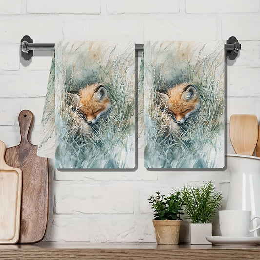 Two pieces of ultra soft kitchen towels featuring a cozy fox playing in grass design. These highly absorbent and machine washable dish hand towels are perfect for contemporary coastal decor. Each towel measures 40.64x60.96 cm.