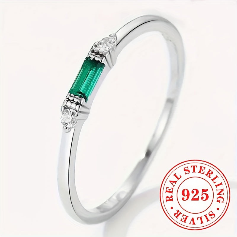 Delicate Sterling Silver Ring adorned with Baguette Cubic Zirconia and a Synthetic Green Gemstone, perfect for everyday wear or special occasions. This elegant piece is suitable for stacking and makes a thoughtful gift for women.