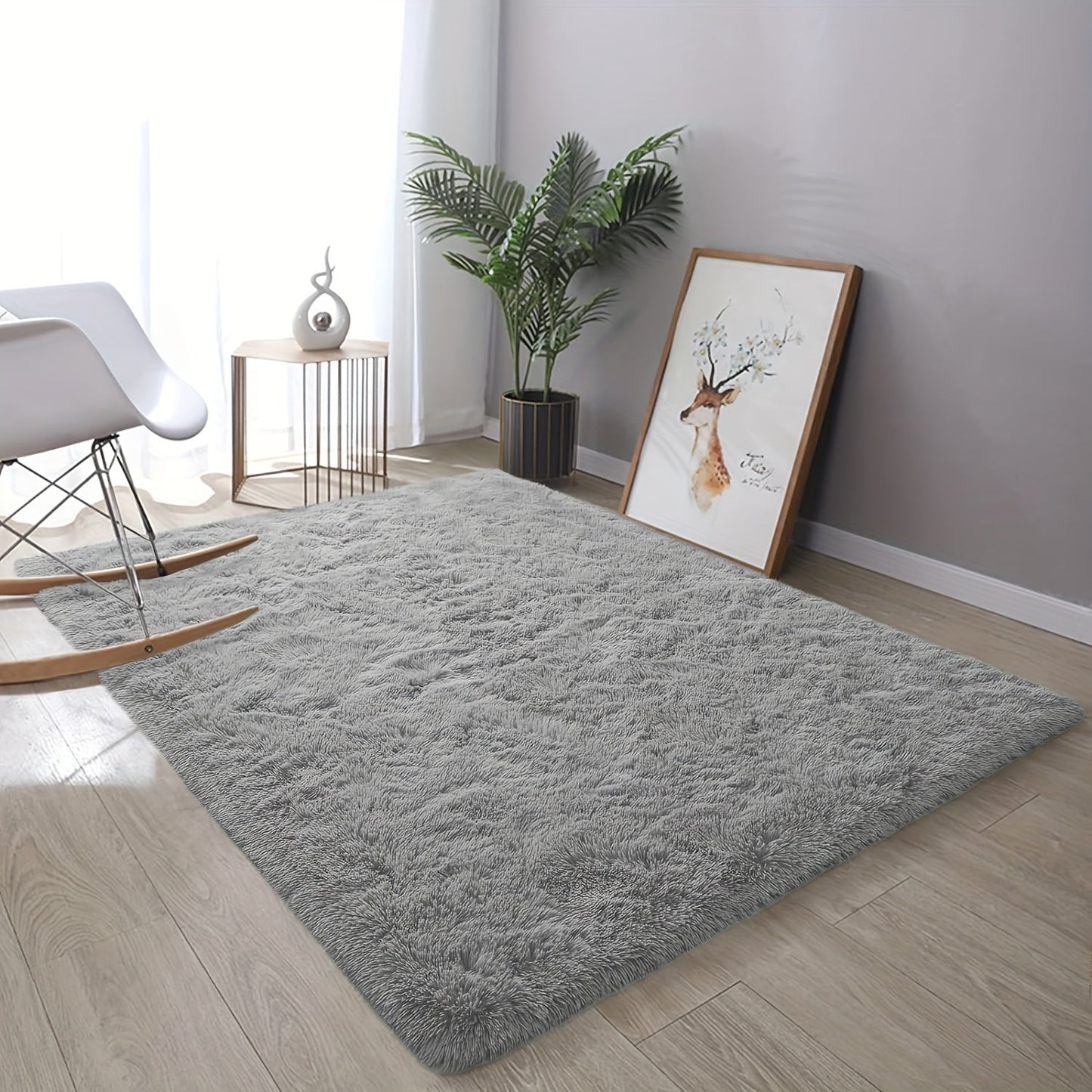 Soft shaggy area mat with a tie-dye design, made with 260g polyester and a 0.6cm thick sponge base. Features a 21 density for added comfort. Machine washable and suitable for indoor use in living rooms, bedrooms, game rooms, and dorms. This Nordic style