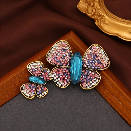 Vintage-inspired women's fashion accessory, this Elegant Luxury Rhinestone Butterfly Brooch Pin adds a touch of elegance to any outfit. The sparkling suit coat corsage ornament is a must-have for any stylish woman.