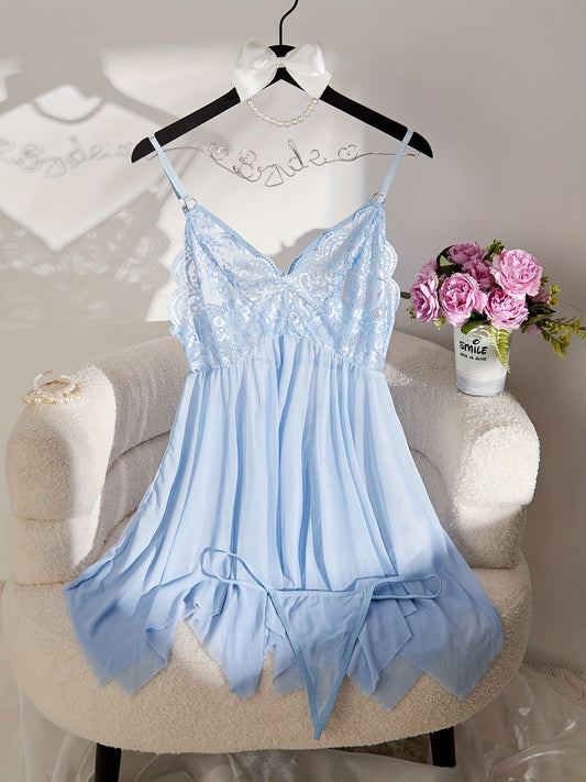 Feminine lace and sheer slip dress set with matching thong, perfect for special occasions and intimate moments. Features V-neck with ruffle detail, made of polyester blend, and hand