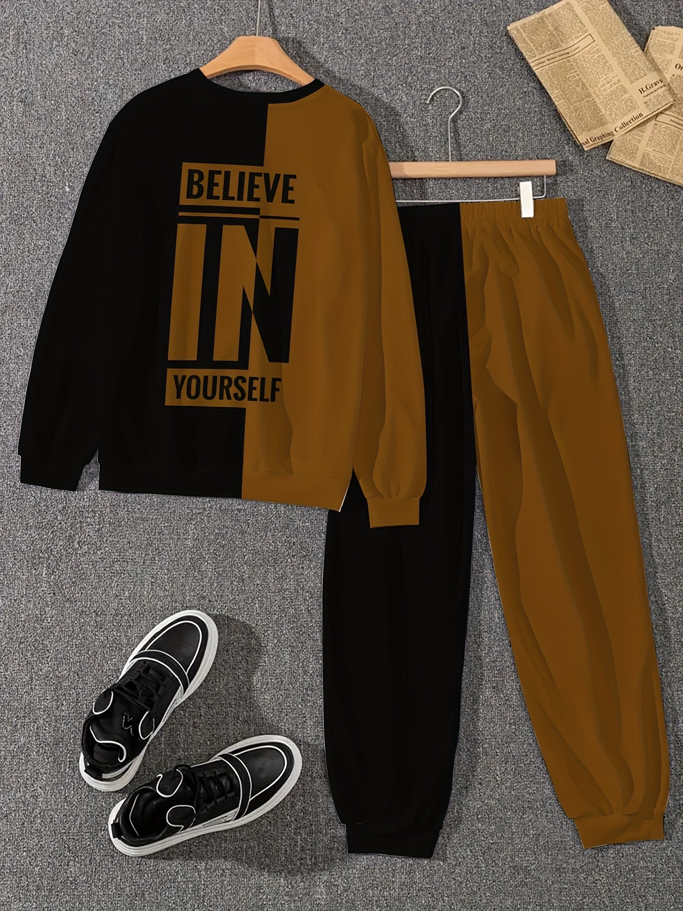 Men's polyester knit tracksuit featuring a crew neck long sleeve sweatshirt and joggers with "BELIEVE IN YOURSELF" print, offering a comfortable slight stretch in a two-piece outfit.