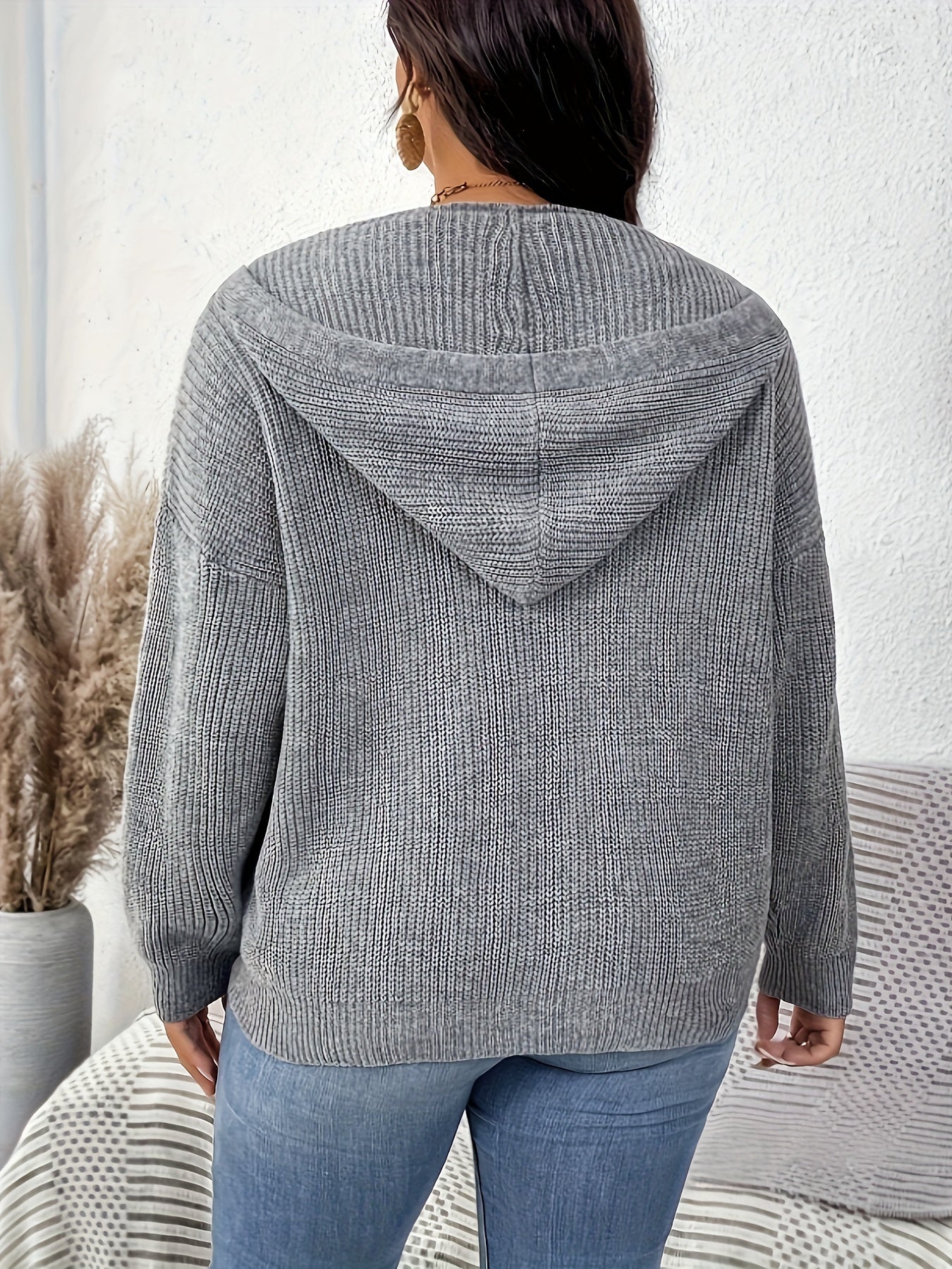 Gray cardigan with hood and drawstring detail, ideal for fall/winter wardrobe.