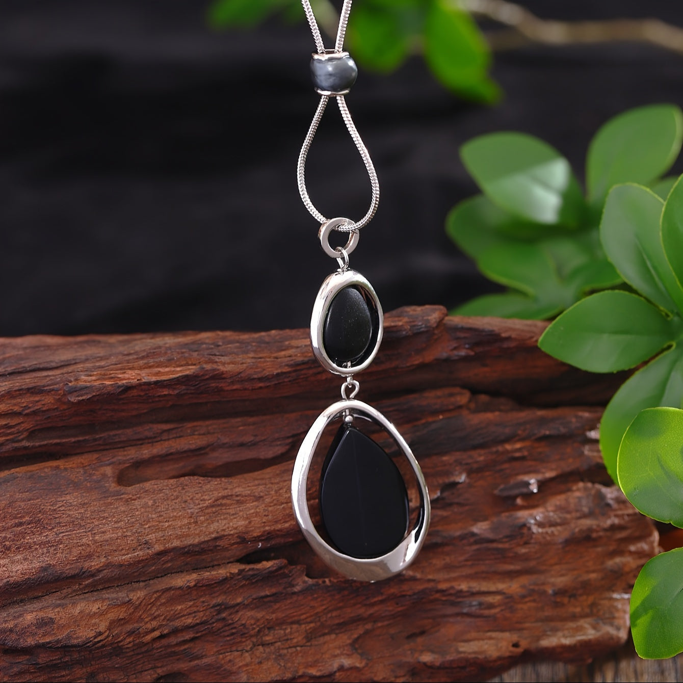 A stylish and sophisticated black stone geometric pendant necklace, perfect for women's accessories. Made from trendy zinc alloy, this long necklace is ideal for daily wear, parties, proms, vacations, and makes a great jewelry gift.