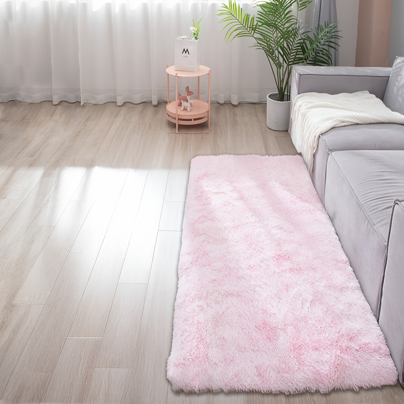 Soft and fluffy rectangle area rug perfect for your bedroom. This plush carpet is thick and non-slip, making it ideal for your living room. Made with machine-made polyester fiber, this low-pile rug is washable for easy cleaning. Perfect for indoor use.