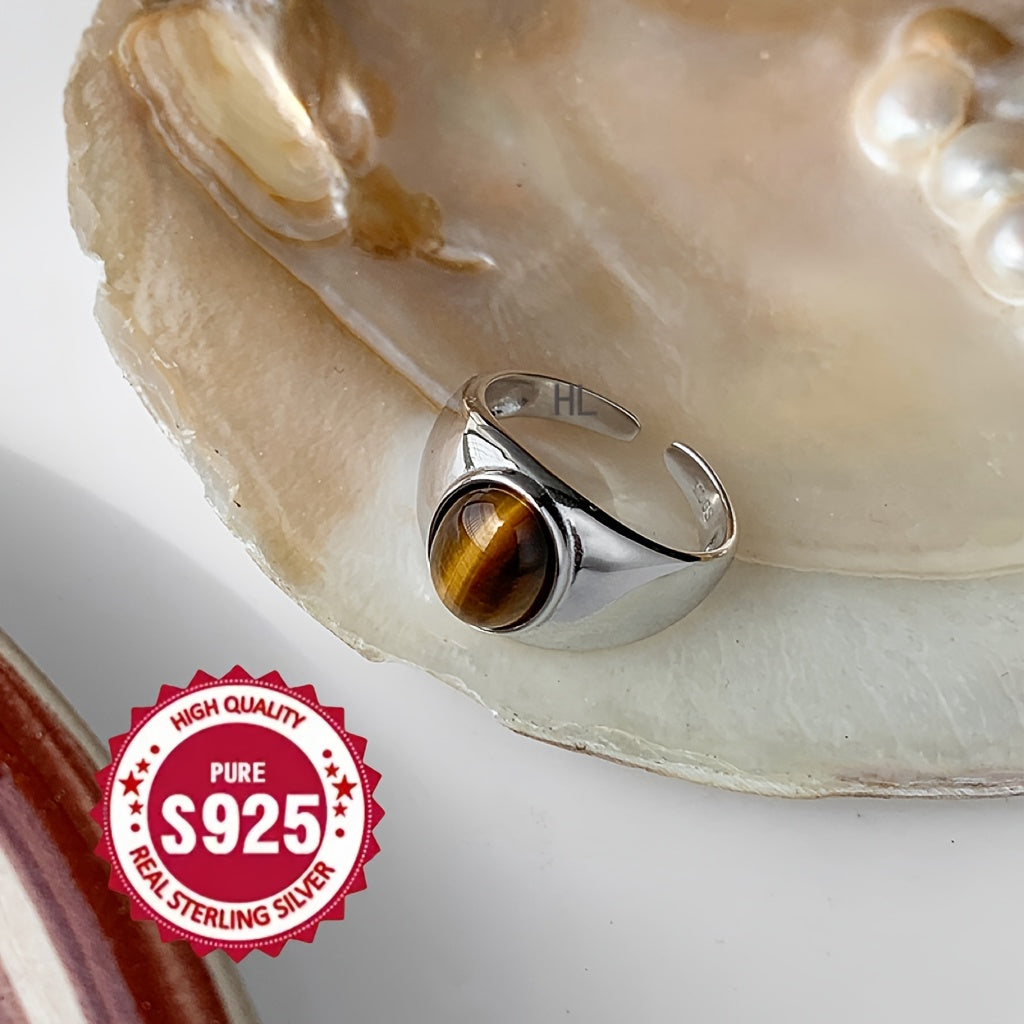 A versatile S925 silver ring adorned with a natural Tiger's Eye stone, offering impeccable quality and intricate design. Perfect for both men and women, showcasing a stunning appearance that is ideal for gifting or wearing on any occasion, whether it be