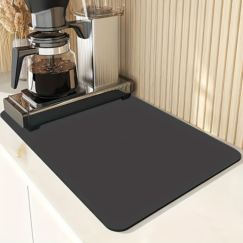 Sleek black dish drying mat absorbs moisture quickly and stays in place on kitchen countertops or tabletops. Ideal for dishes, bowls, and grinders in kitchen, coffee stations, or pet areas.