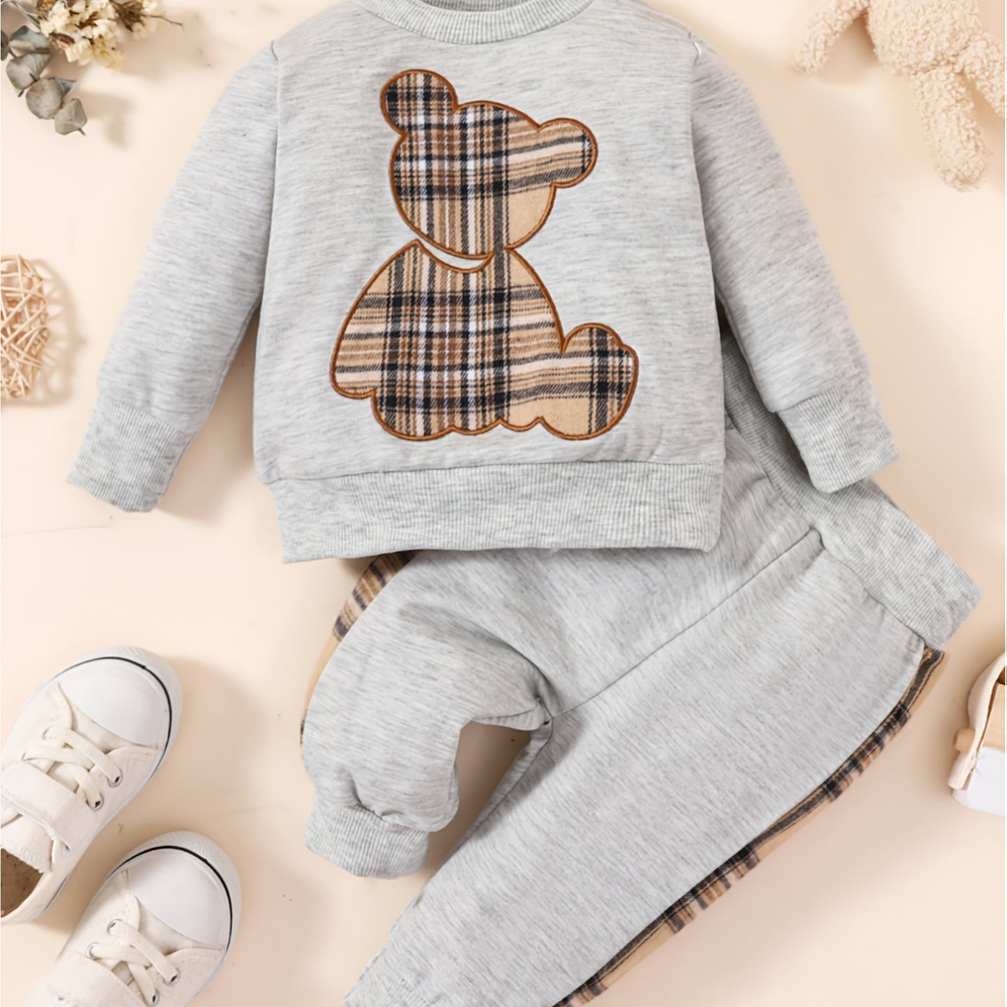 Toddler boy's outdoor fall/winter outfit with long sleeve sweatshirt and casual pants.