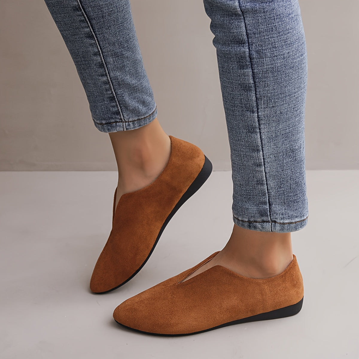 Women's solid color casual flats with a soft sole and point toe.