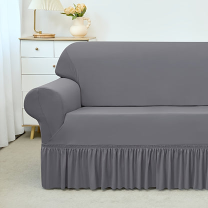 Elastic waterproof sofa slipcover with skirt for all seasons, ideal furniture protection for home and office.