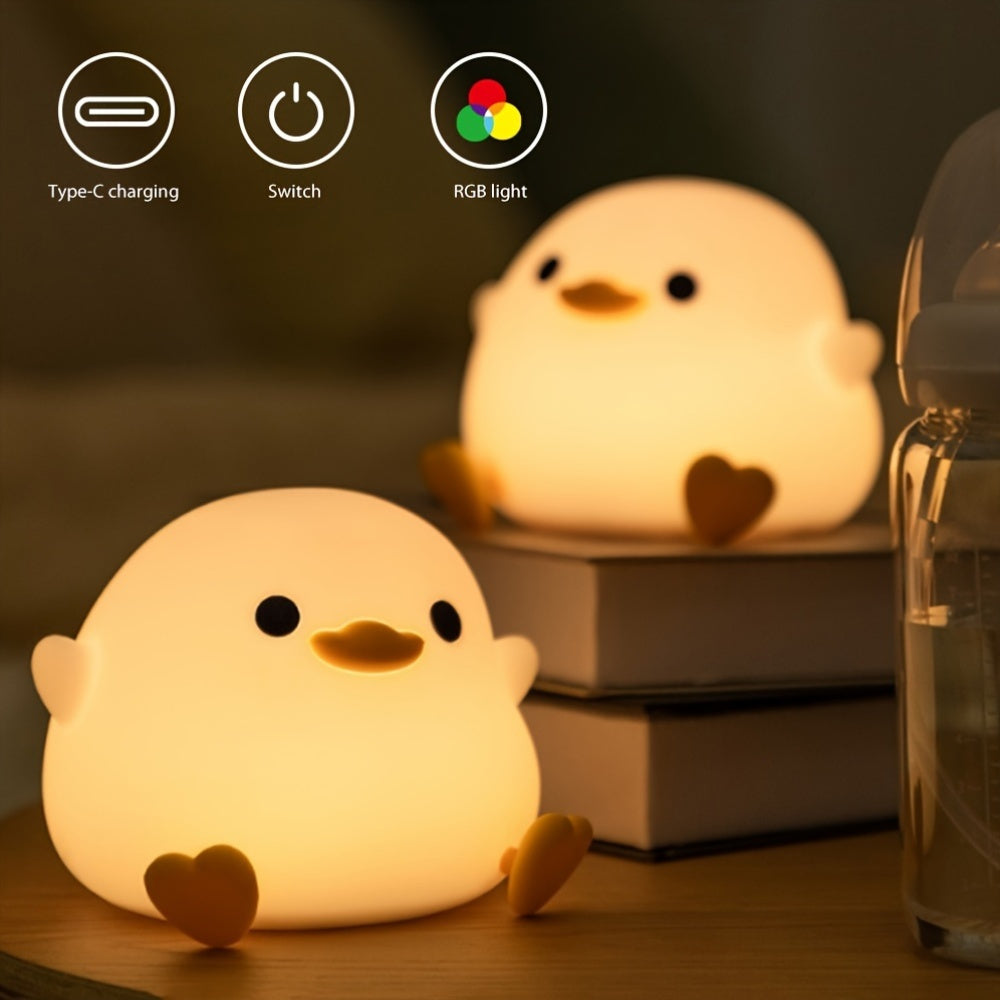 Cute duck-shaped touch control night light with RGB color changing, soft silicone bedside lamp, USB-C rechargeable desk light, perfect gift for any room.