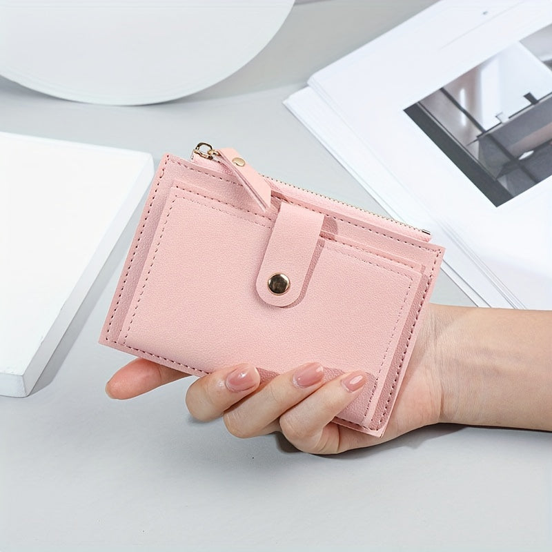 Sleek women's wallet with snap button zipper in pink, light brown, blue, and black. Lightweight, portable, bifold design made of TSA-approved PU material. Ideal for cash, ID, credit cards