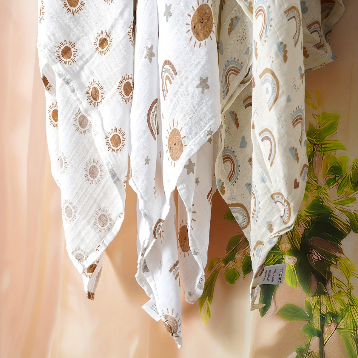 Three Elinfant Swaddle Blankets made from bamboo cotton muslin for newborns. These soft gauze bath towels are recommended for hand washing only and are suitable for children aged 0-3 years old.