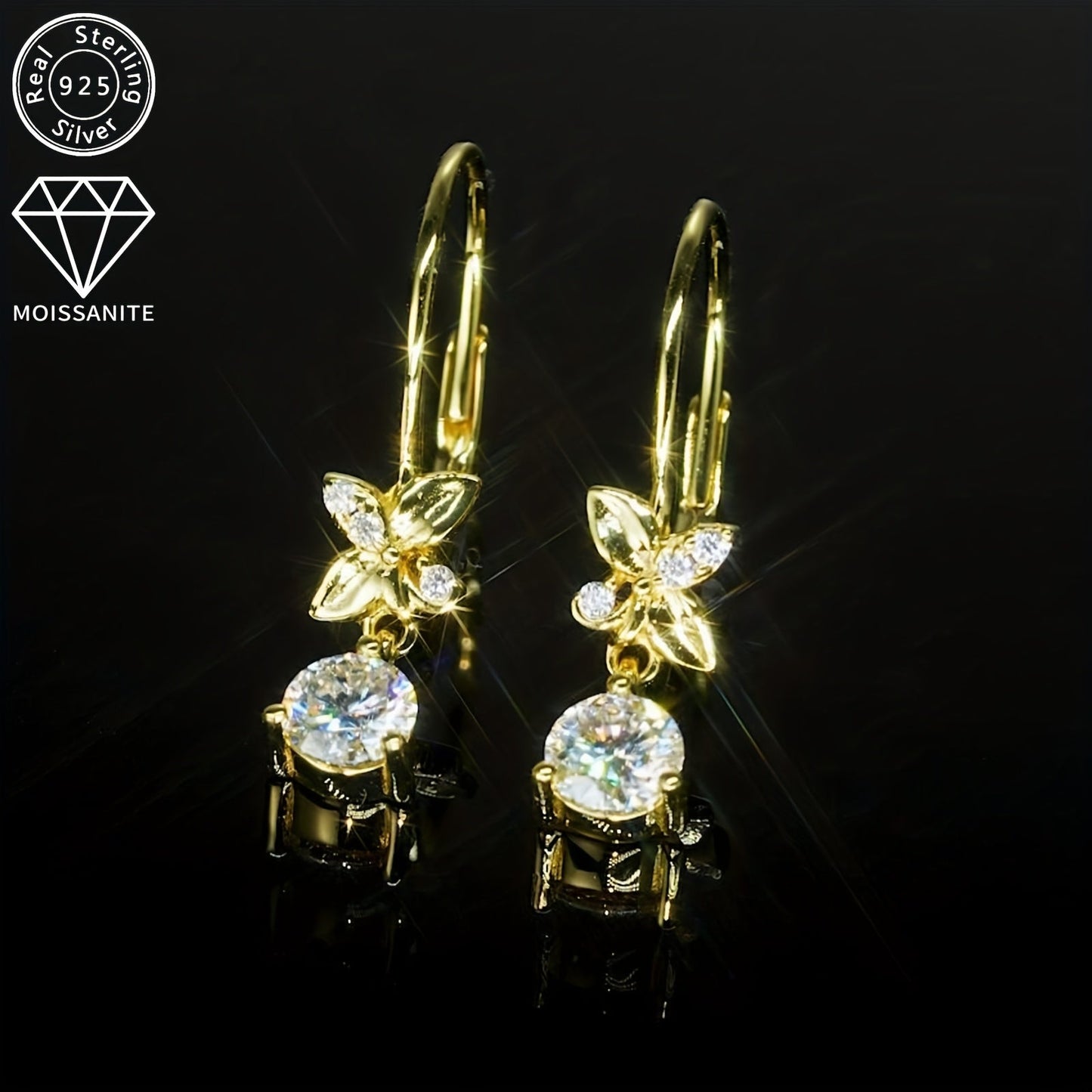 These 925 Silver earrings feature a pair of Moissanite stones, with measurements of 5mm x 2pcs and 1.3mm x 6pcs. The total carat weight is 0.53ct x 2pcs, making for a stunning and stylish pair of dangle earrings. These round synthetic Moissanite earrings