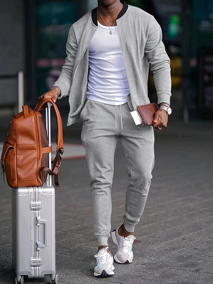 Men's travel-friendly sporty tracksuit set with long sleeve zip-up jacket and joggers, perfect for leisure and outdoor activities. Made of polyester.