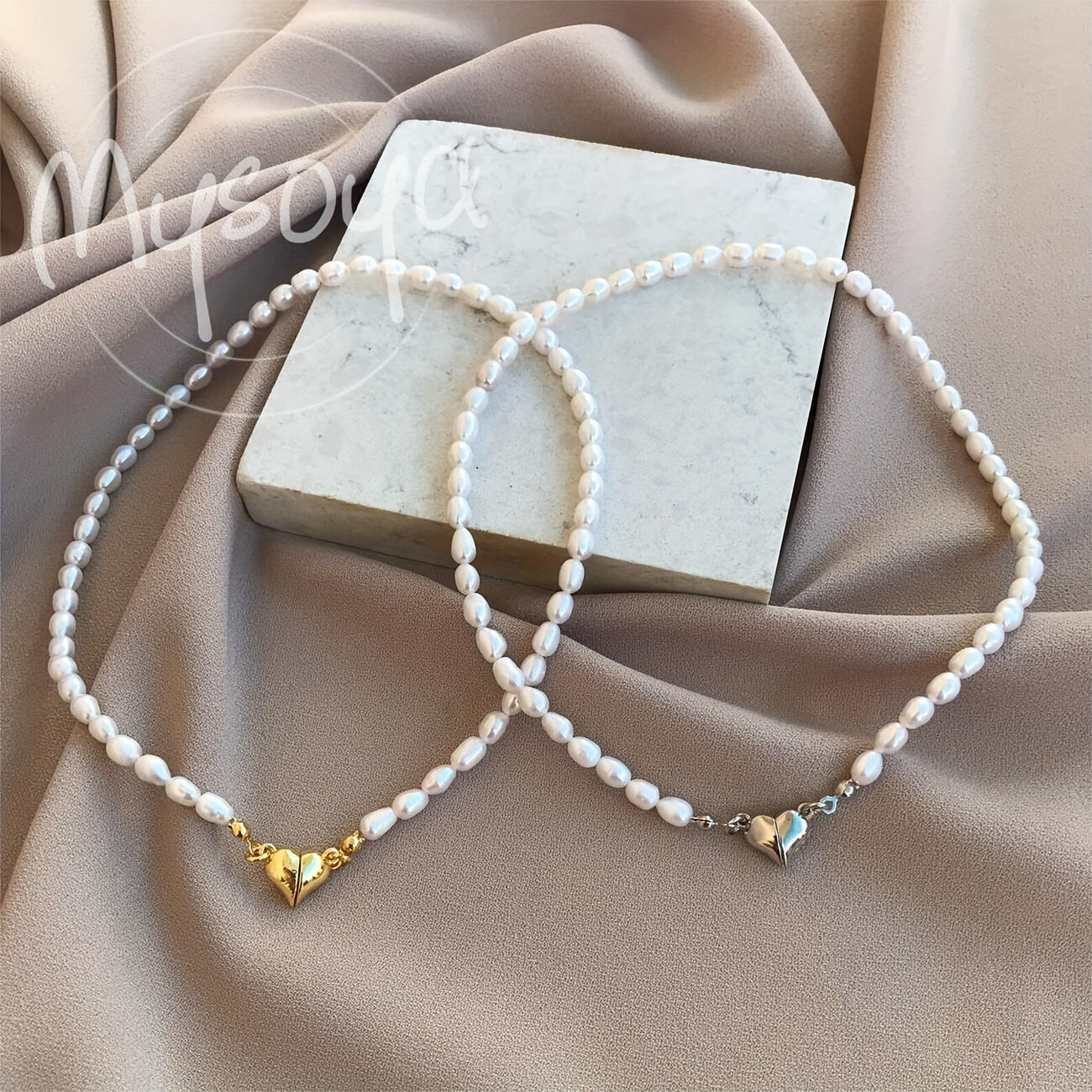 MYSOYA presents a stunning handmade necklace featuring natural freshwater rice-shaped pearls, adorned with a golden or silvery heart. The 6-7mm pearls come beautifully packaged in a gift box, making it a perfect jewelry gift for him or her. Ideal for