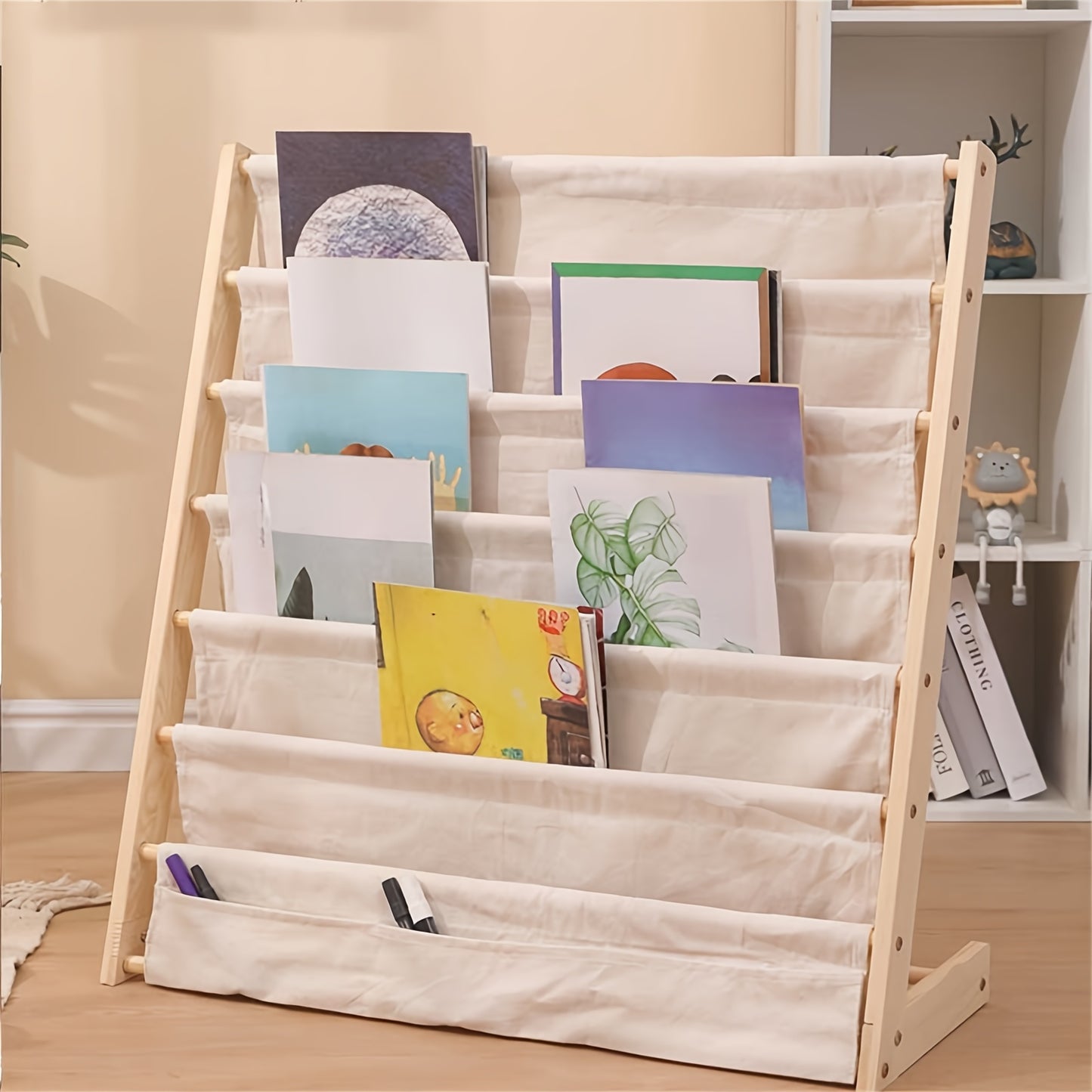 Wood bookshelf with fabric pockets and rounded edges, secured with screws.