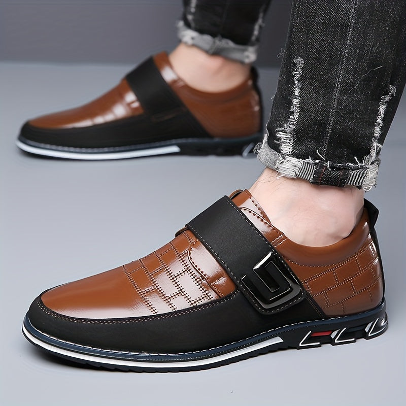 Men's dress loafers with hook and loop fastener for business or casual wear.