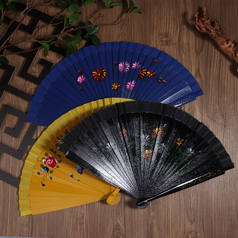 Wooden Spanish folding fan for dancing and home decoration with printed design, conveniently folds for easy storage.