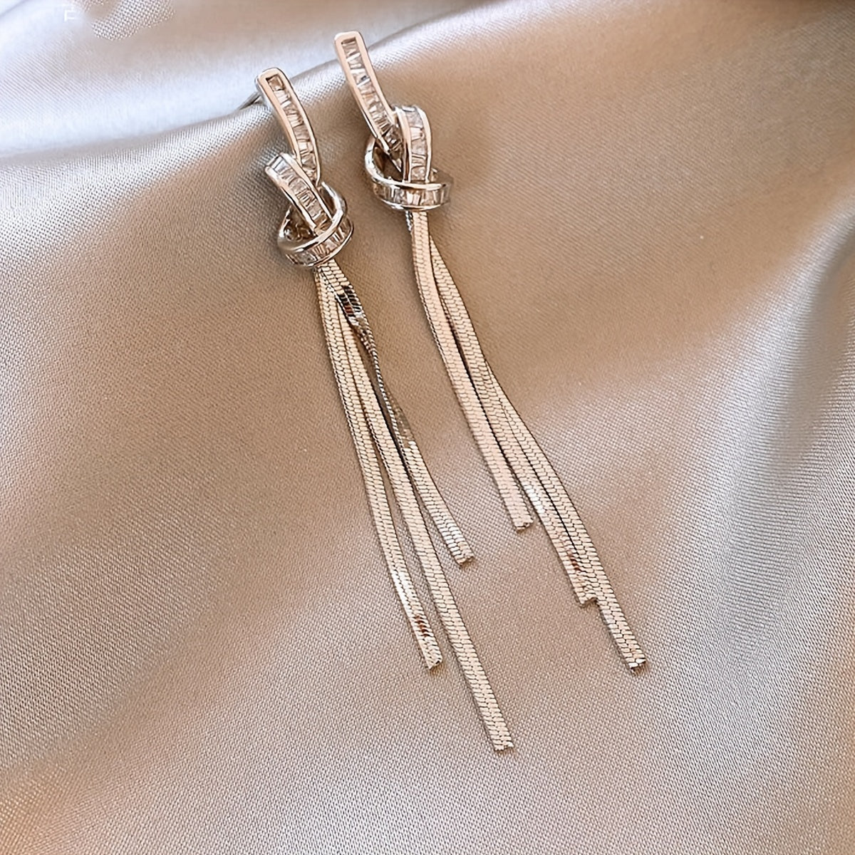 New for 2024, these unique sterling silver needle earrings feature long tassels for a light luxury look that is sure to elevate any outfit.