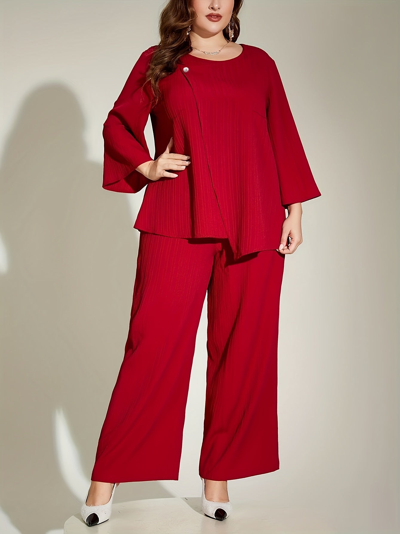 Chic red ribbed suit set for elegant plus size women, includes 3/4 sleeve top and wide-leg pants. Made of polyester, machine washable.