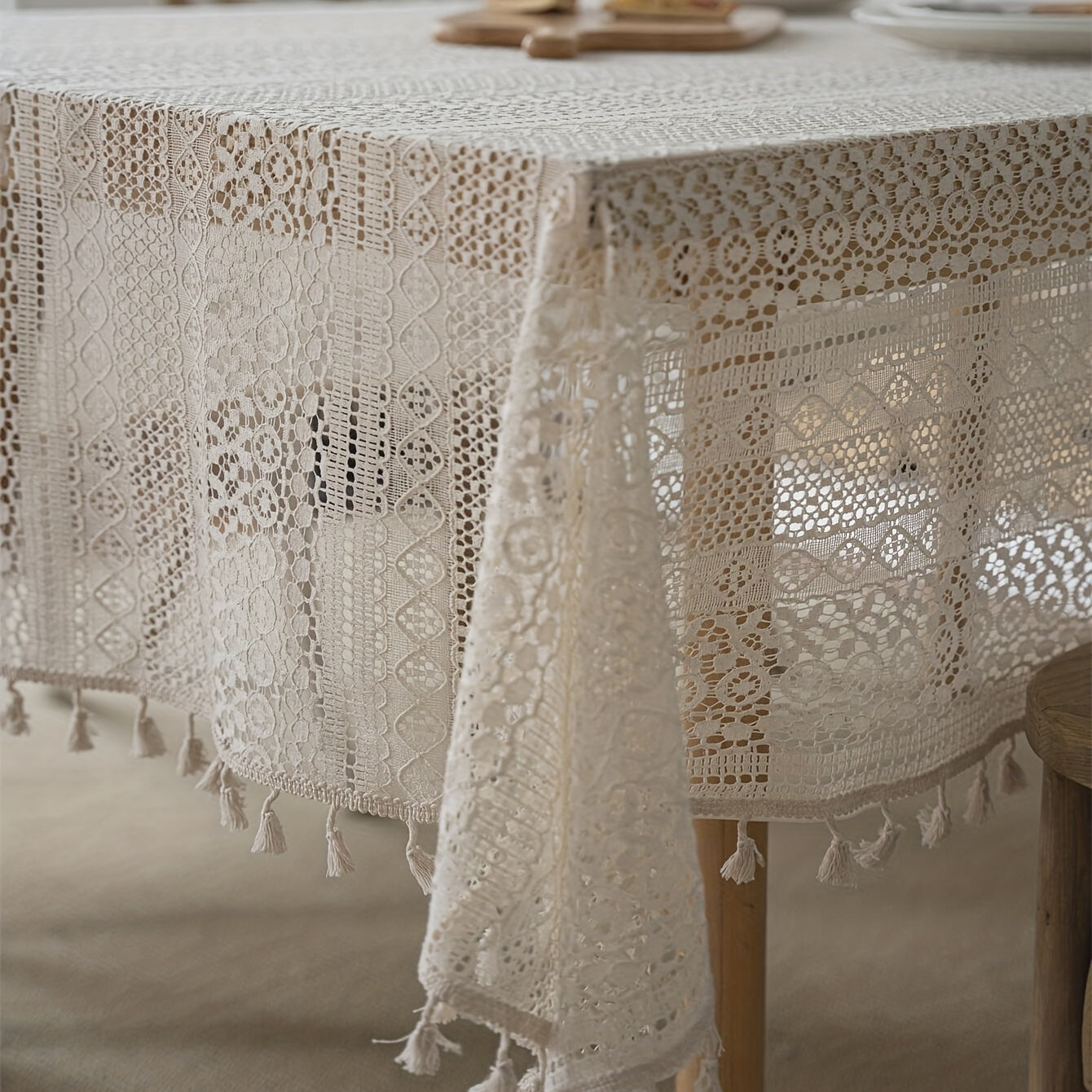 Bohemian chic crochet lace tablecloth, ideal for dining and parties. Rectangular polyester design with a farmhouse style, perfect for boho home decor. Great for buffet tables, banquets, and serving western food.