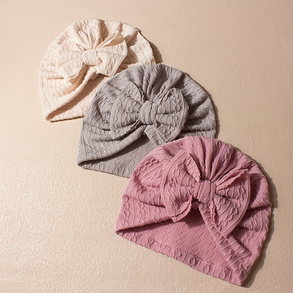 Soft and cute bow pullover caps for kids, available in packs of 3 or 6. Ideal for daily wear.