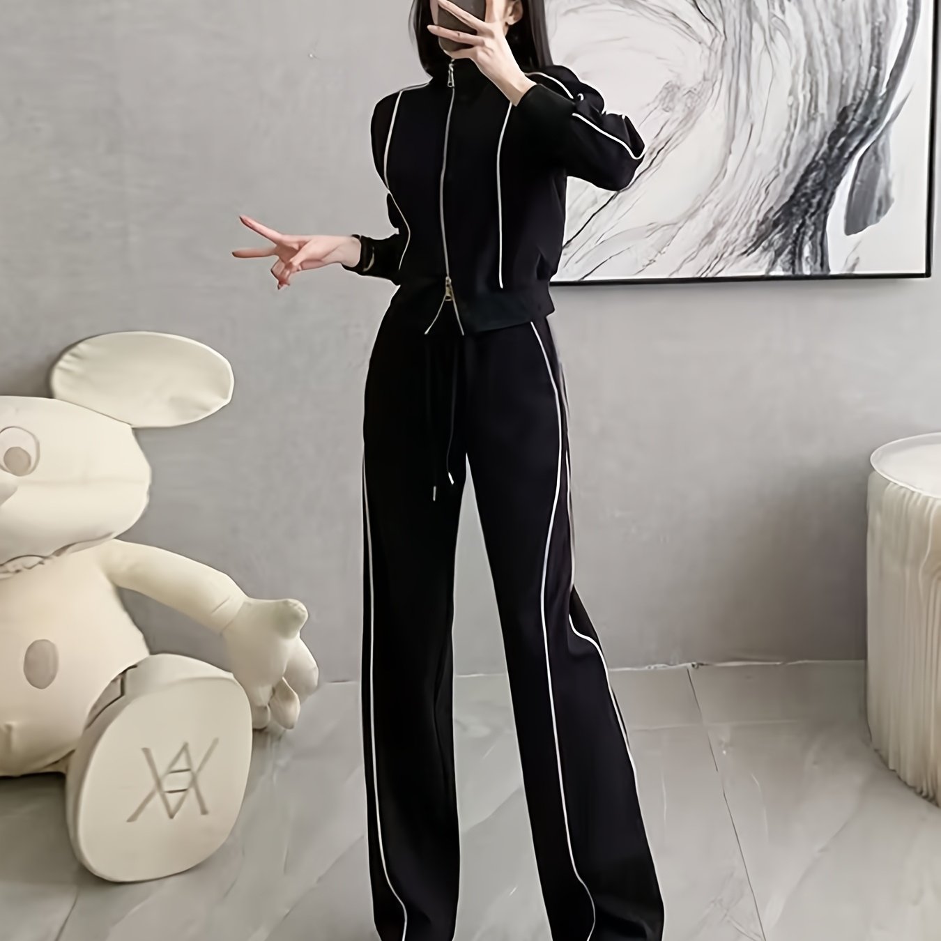 Women's zip-up cardigan and high-waist wide-leg pants set in black, perfect for casual wear. Made from a polyester blend with long sleeves, solid color, and a high-grade European and