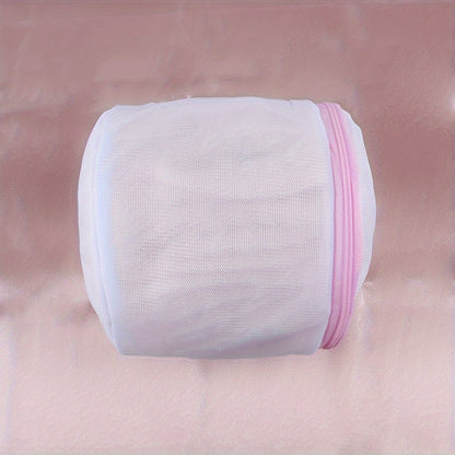 Sturdy polyester mesh laundry bag for delicates with fine grid, pink zipper. Hand washable, prevents deformation in washing machine. Breathable mesh design, laundry room essential.