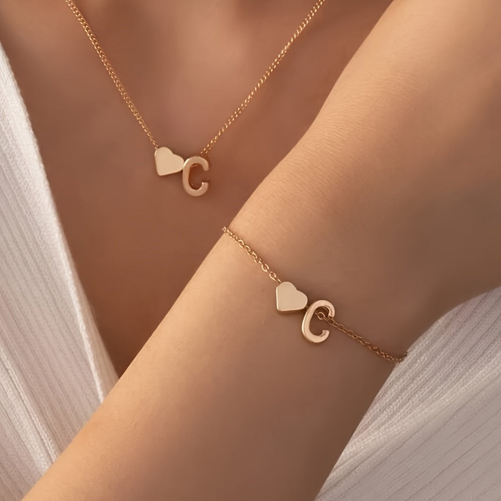 Chic two-piece set with metal heart and letter necklace and bracelet, ideal for daily wear.