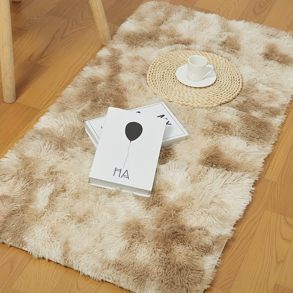 Soft shaggy area mat with a tie-dye design, made with 260g polyester and a 0.6cm thick sponge base. Features a 21 density for added comfort. Machine washable and suitable for indoor use in living rooms, bedrooms, game rooms, and dorms. This Nordic style