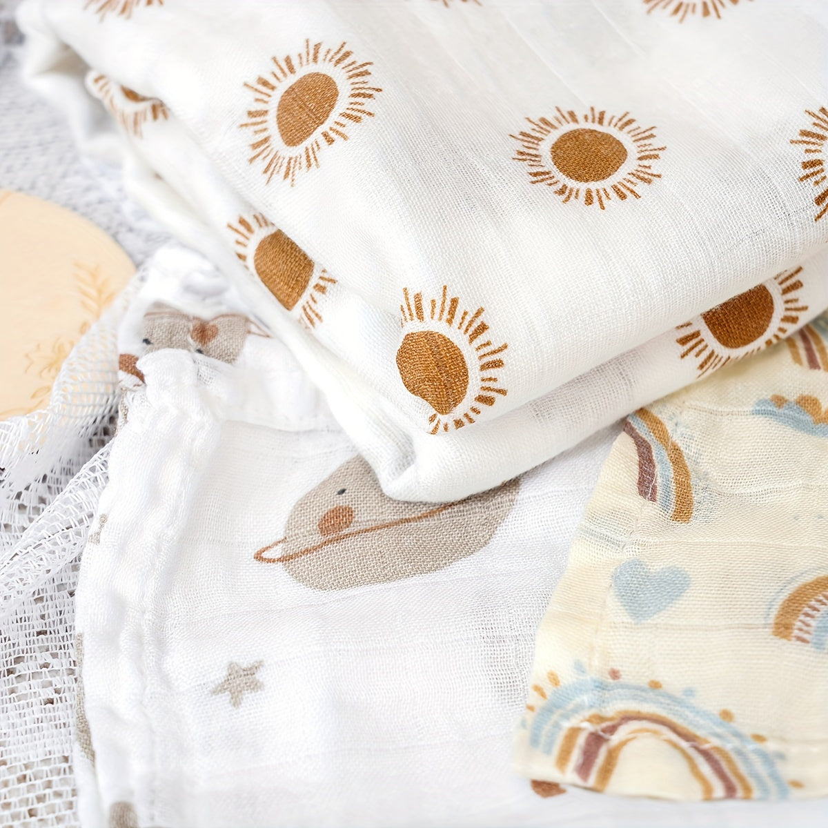 Three Elinfant Swaddle Blankets made from bamboo cotton muslin for newborns. These soft gauze bath towels are recommended for hand washing only and are suitable for children aged 0-3 years old.