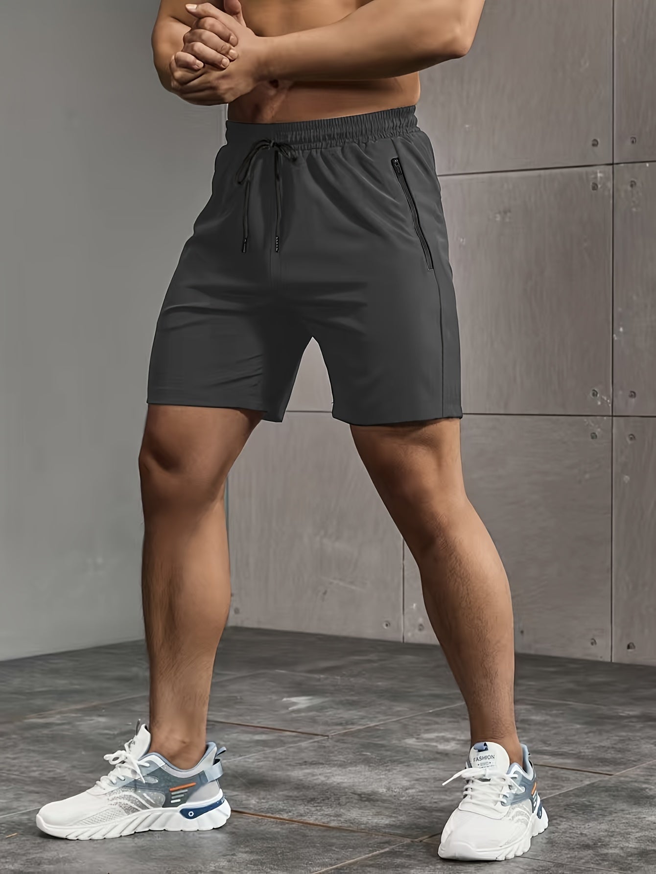 Men's casual style shorts with zip pockets, drawstrings, and performance letter print, ideal for summer outdoor activities.