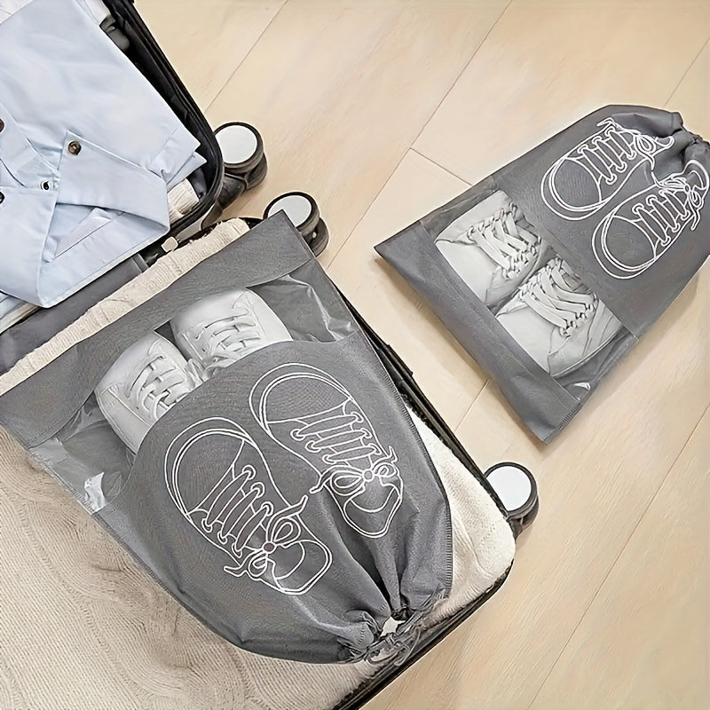 5 Portable shoe storage bags with drawstring made of waterproof, non-woven fabric for travel and closet organization.