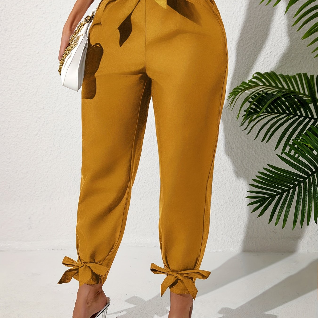 Solid straight leg pants with elastic drawstring waist and elegant bow detail. Perfect for spring and summer in plus size.