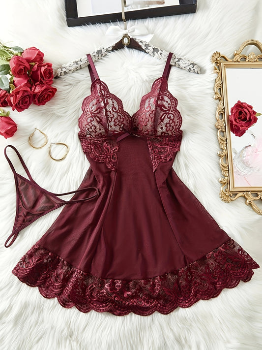 Stylish burgundy lace lingerie set for women includes slip dress with deep V-neck and thong. Made of semi-sheer polyester with lace detailing. Hand washable.