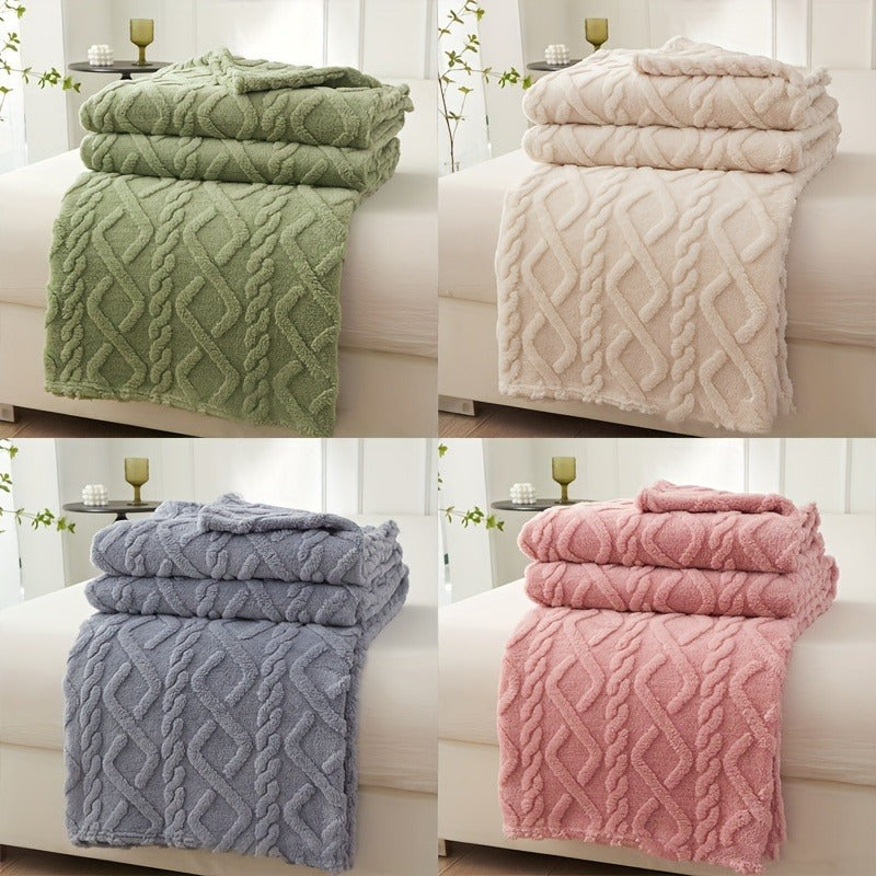 Cozy coral fleece blanket in chic diamond pattern. Ultra-soft, warm, and comfortable for bed, sofa, or travel. Available in beige, green, pink, and blue. Made of lightweight polyester. Hand wash only.