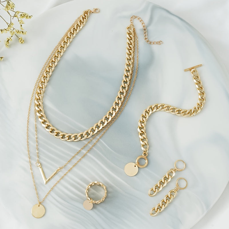 Choose your style with this trendy hip hop jewelry set featuring a 14k gold plated V shape pendant and chain design. The set includes 5 pieces - a necklace, bracelet, earrings, and ring. Available in golden or silvery tones, make your call now.