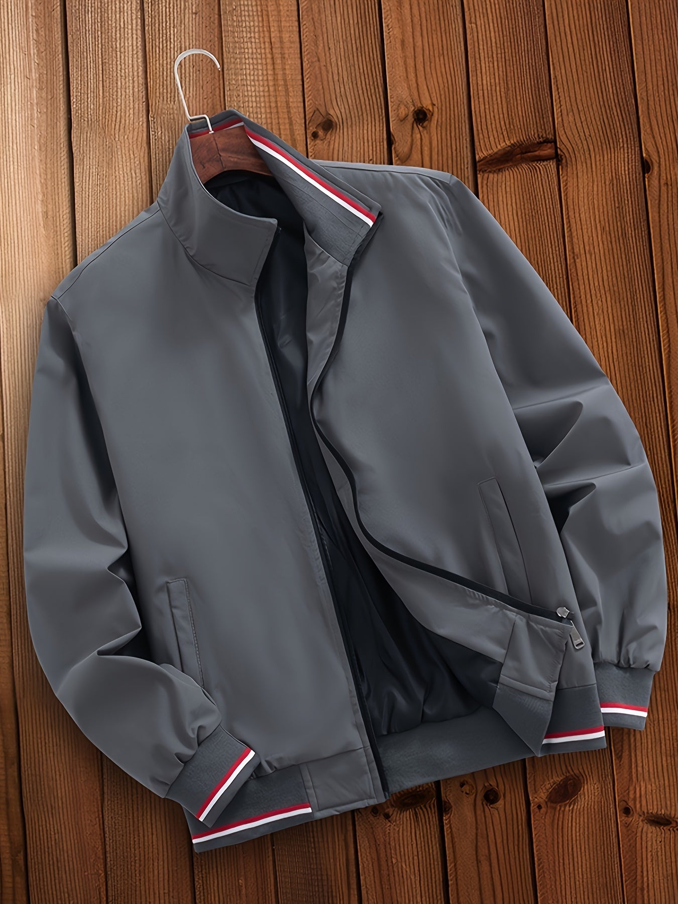 Men's casual striped jacket with pockets, stand collar, zipper closure, and long sleeves, suitable for outdoor wear.