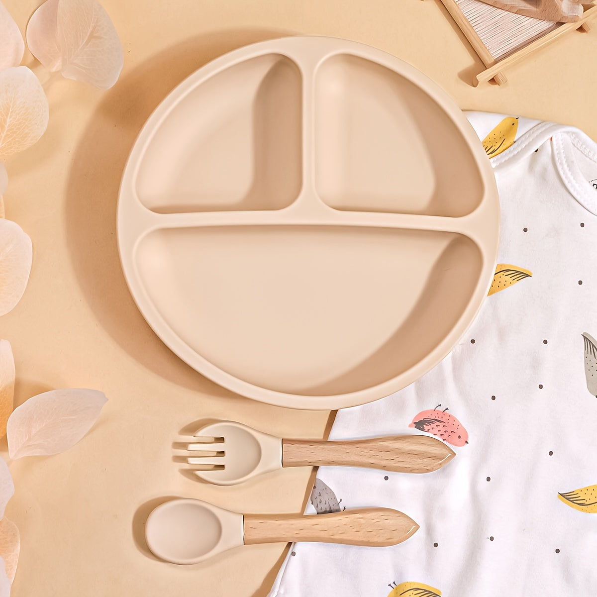 TYRY.HU offers a 3-piece set of baby feeding essentials made from 100% silicone. The set includes a divided suction plate, led weaning set, and plates and utensils set. Perfect for mealtime, this tableware set includes a plate and spoon. Makes a great