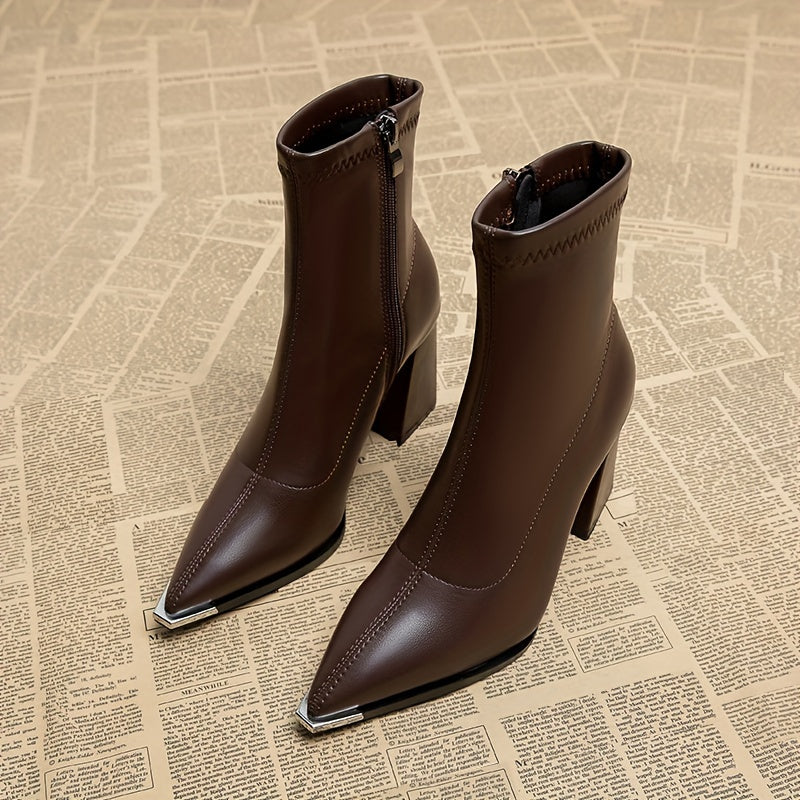 Stylish ankle boots with pointed toe, chunky heel, faux cover, and side zipper closure for all seasons.